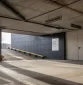 Reklaminis stendas Evolution verslo centro automobilių stovėjimo aikštelėje